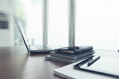 Office workplace with laptop and smart phone on wood table Office workplace with laptop and smart phone on wood table